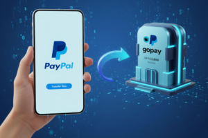 Ilustrasi proses transfer saldo dari akun PayPal ke aplikasi GoPay di ponsel pintar dengan latar belakang rupiah.