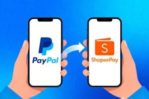 Ilustrasi proses transfer saldo PayPal ke ShopeePay menggunakan smartphone dengan tampilan aplikasi keuangan digital yang aman.